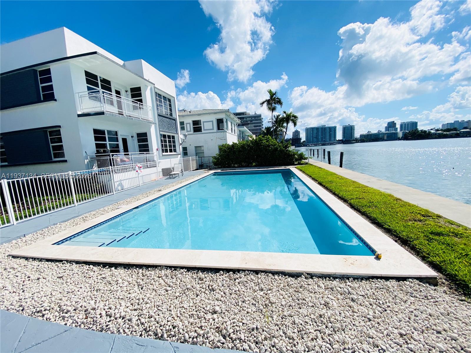 960 Bay Drive, Unit 902 Miami Beach, FL 33141 - Photo 2 of 23 swimming pool view with a seating space