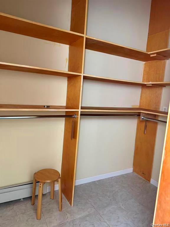 154-60 Riverside Drive Queens, NY 11357 - Photo 17 of 17 a view of a room with racks on the wall