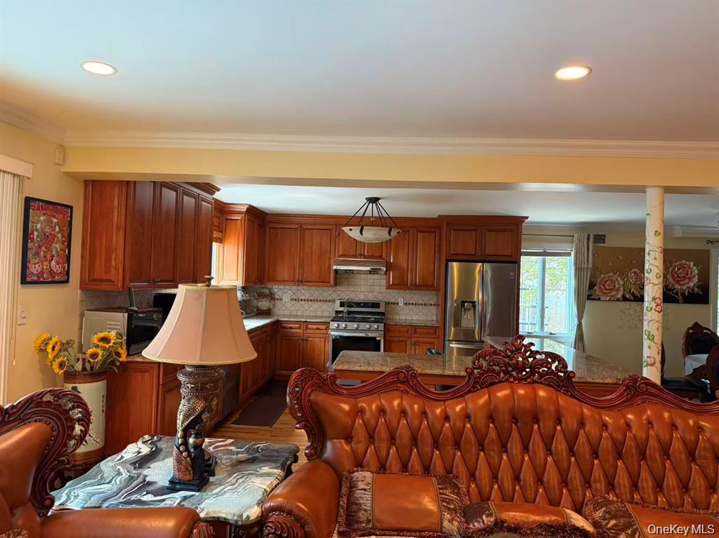 154-60 Riverside Drive Queens, NY 11357 - Photo 3 of 17 a bed room with a bed and furniture