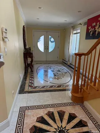 a view of a livingroom with furniture window and staircase