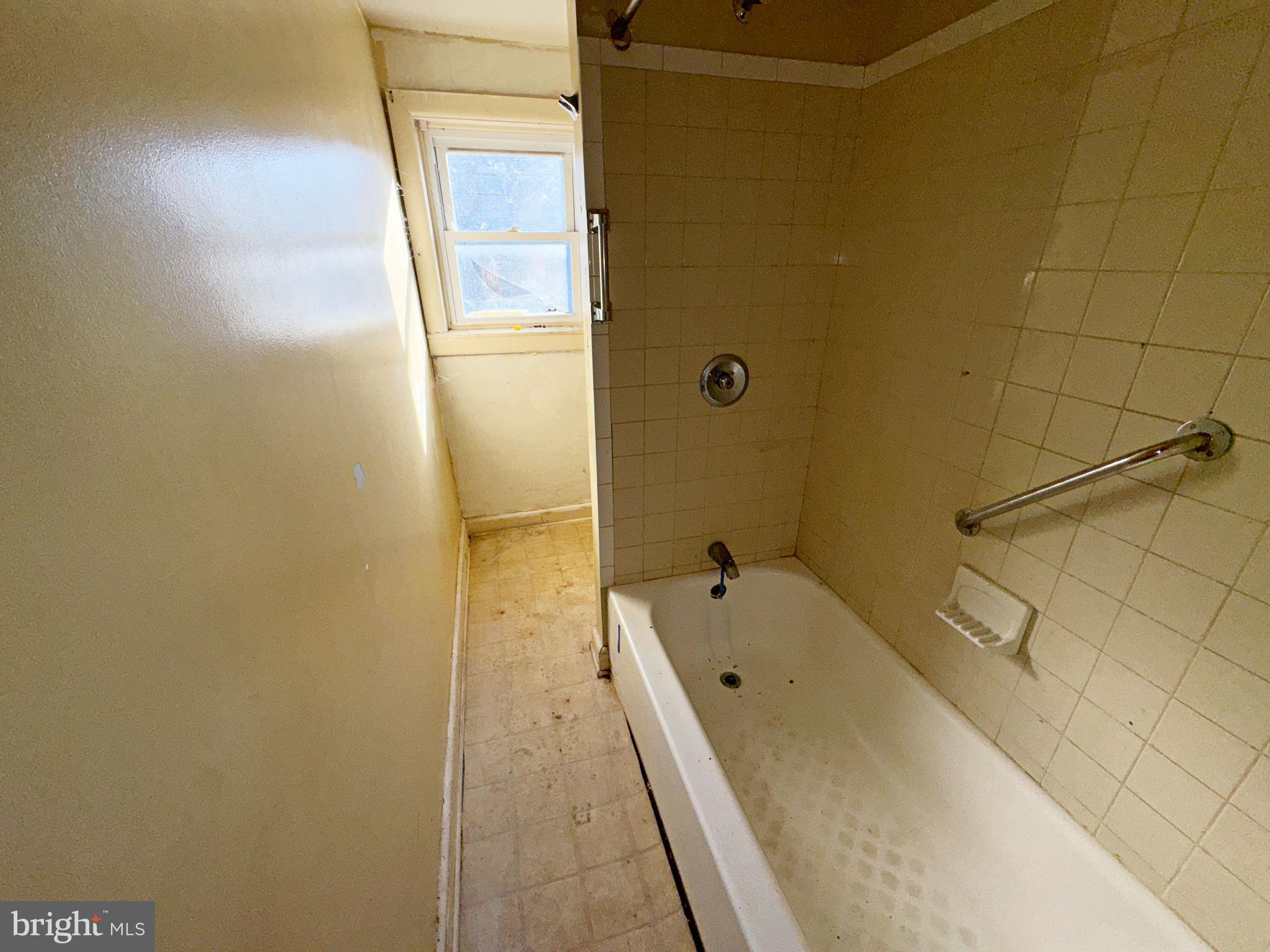 2141 Vine Street Baltimore, MD 21223 - Photo 14 of 15 a bathroom with a tub and shower