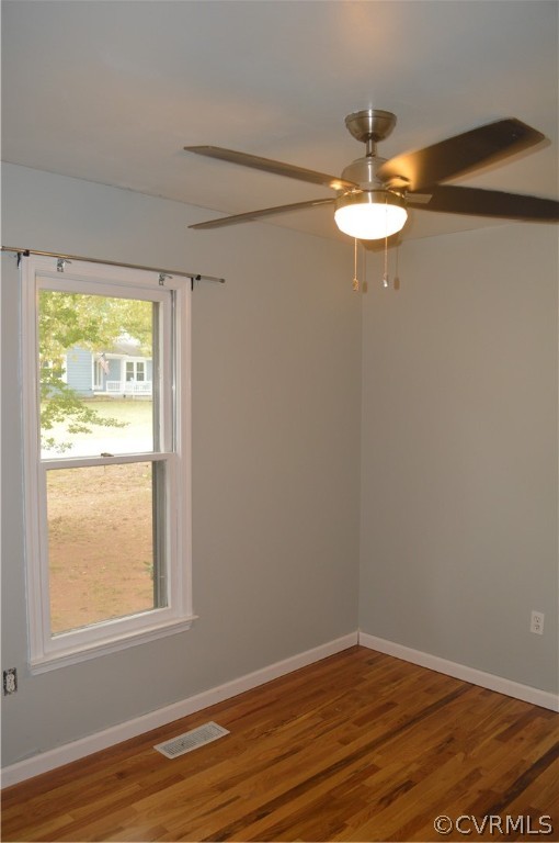 3000 Shiloh Church Road Midlothian, VA 23112 - Photo 8 of 9 an empty room with wooden floor and windows