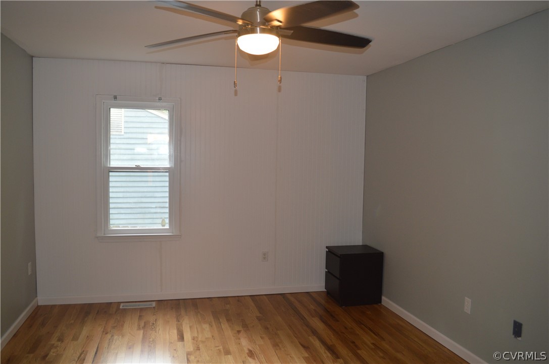 3000 Shiloh Church Road Midlothian, VA 23112 - Photo 9 of 9 an empty room with wooden floor and windows