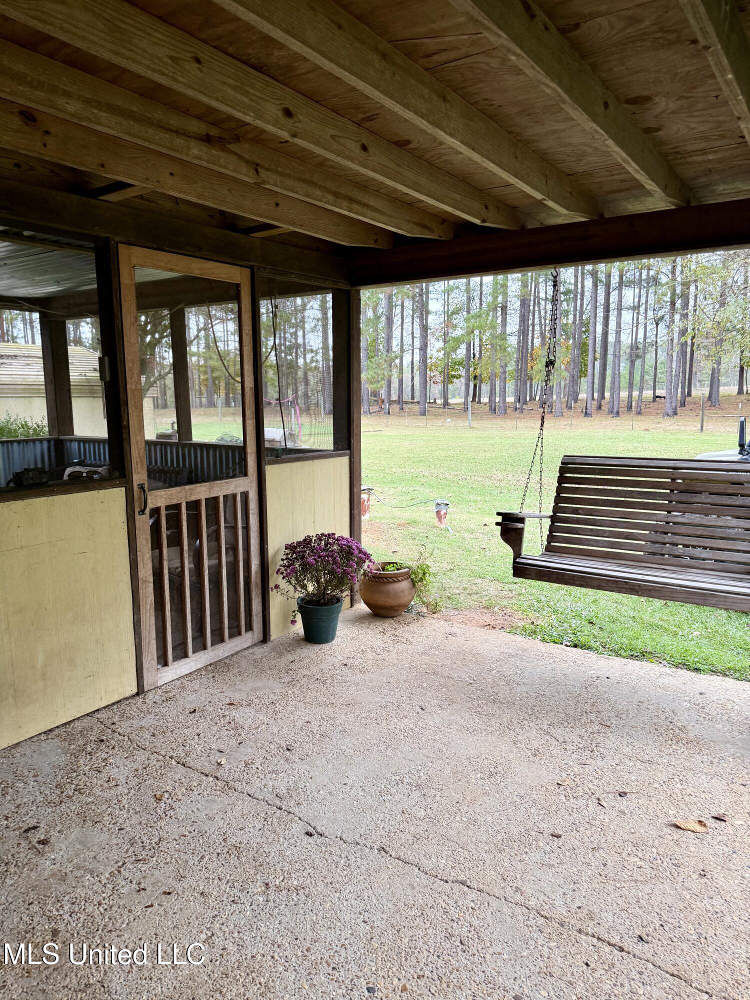 722 Holmesville Road Jayess, MS 39641 - Photo 14 of 47 porch screened 3 patio swing