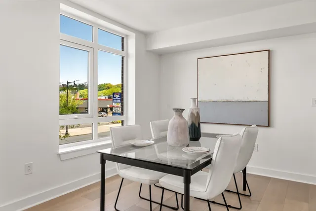 a dining room with furniture and window