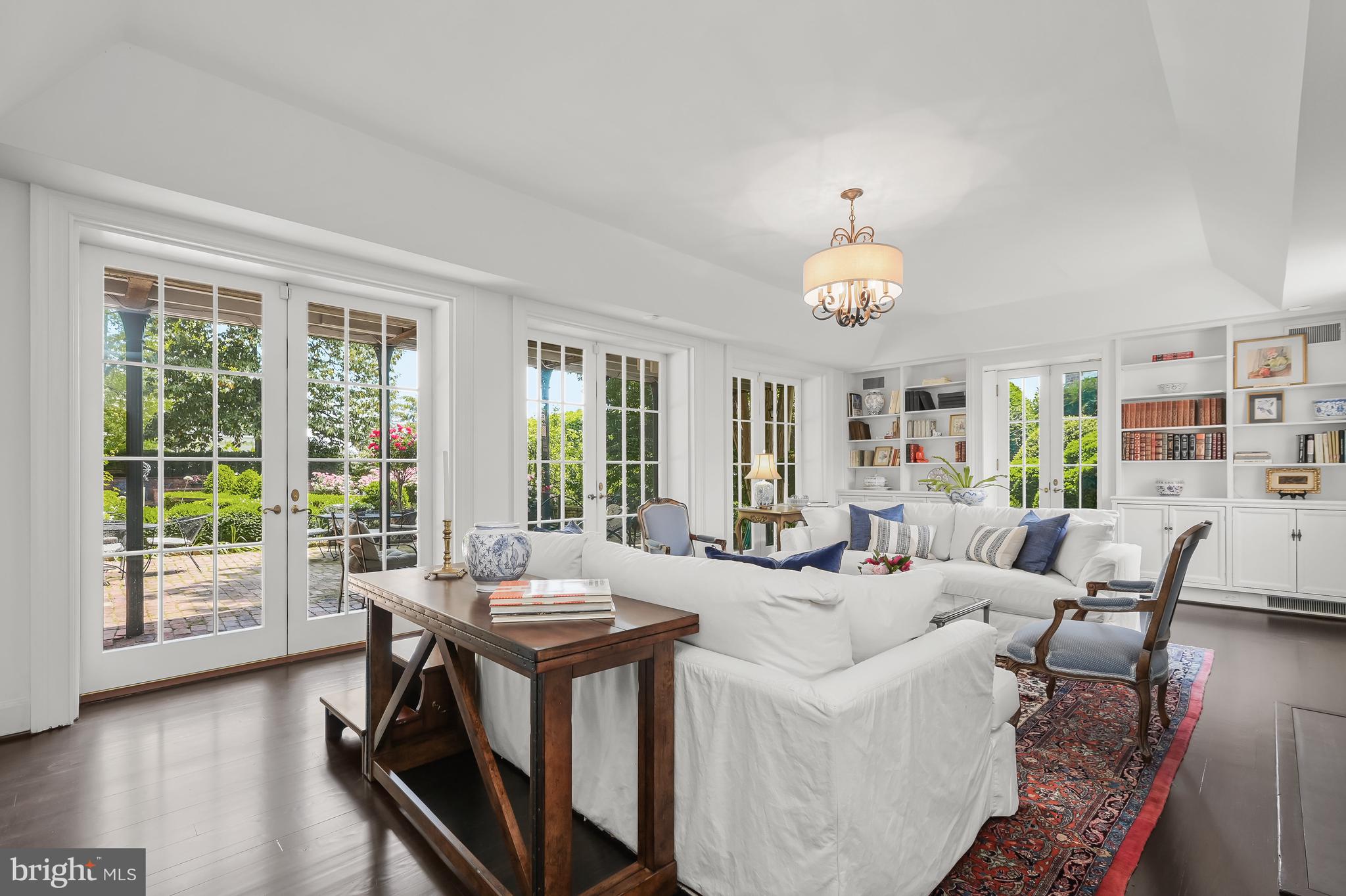 3508 Prospect Street Northwest Washington, DC 20007 - Photo 17 of 39 a living room with furniture and a chandelier