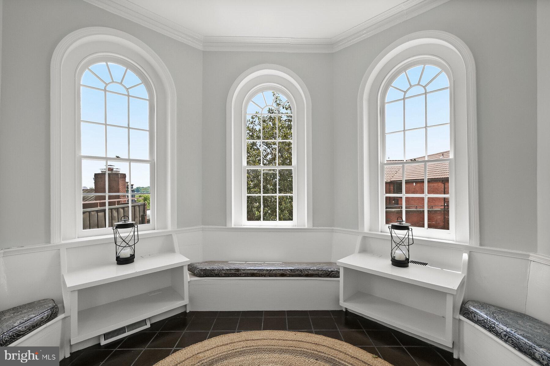 3508 Prospect Street Northwest Washington, DC 20007 - Photo 20 of 39 a bathroom with a two sinks a large mirror and a bathtub next to a window
