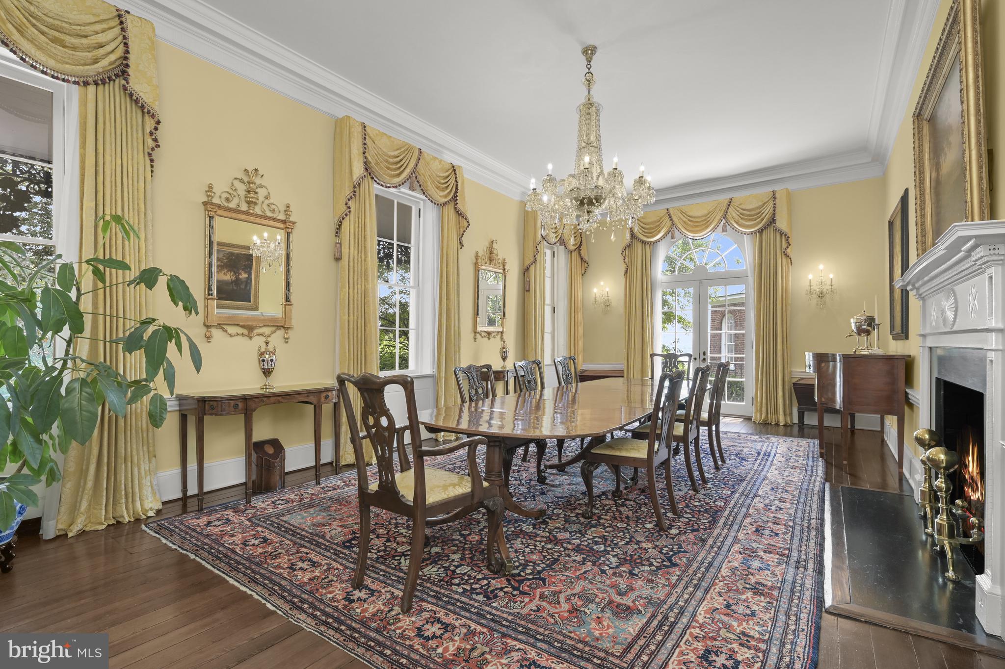 3508 Prospect Street Northwest Washington, DC 20007 - Photo 9 of 39 a view of a dining room with furniture a chandelier and wooden floor