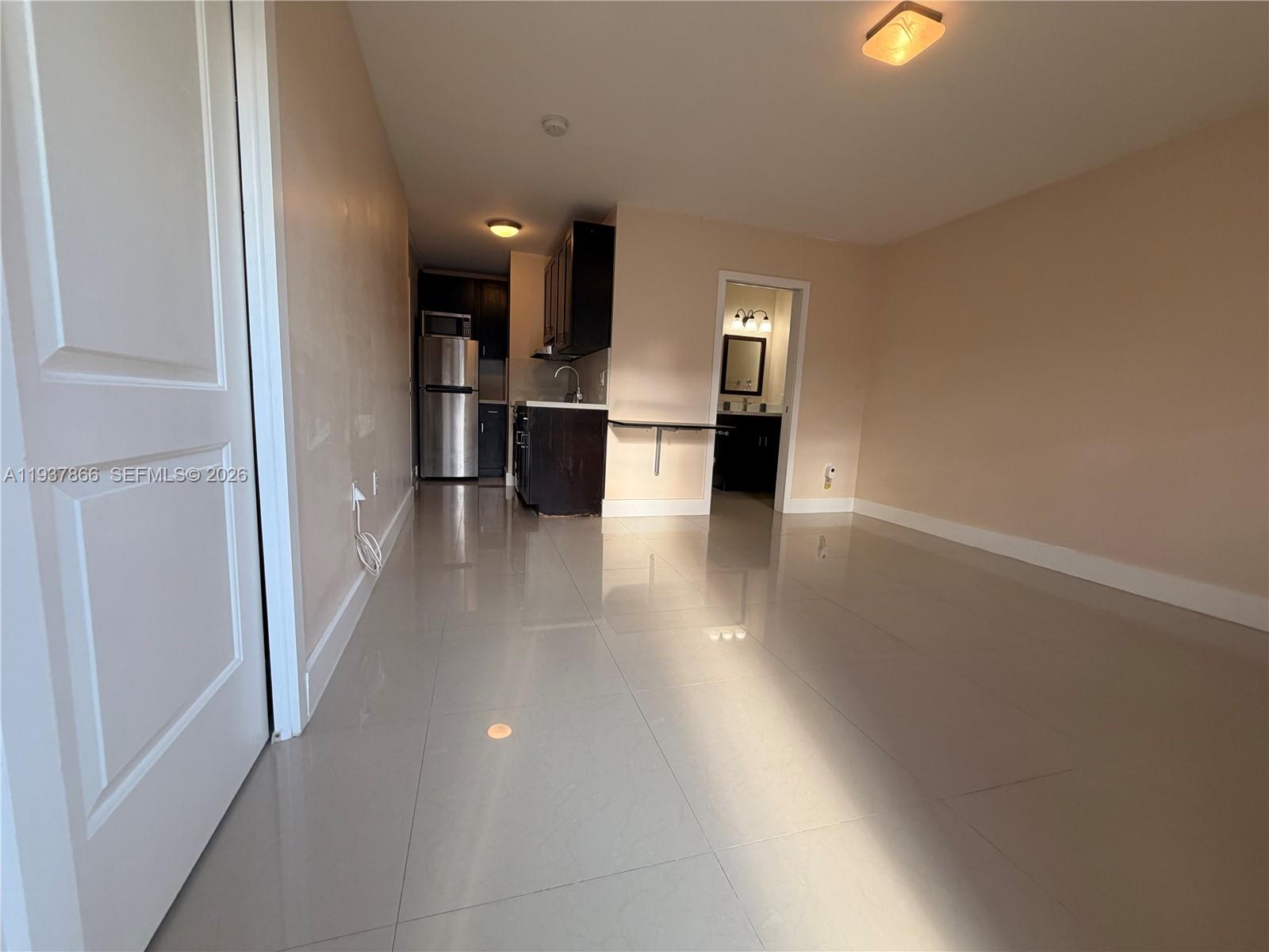 15337 Southwest 62nd Terrace, Unit B Miami, FL 33193 - Photo 4 of 9 a view of a kitchen with a sink and cabinets