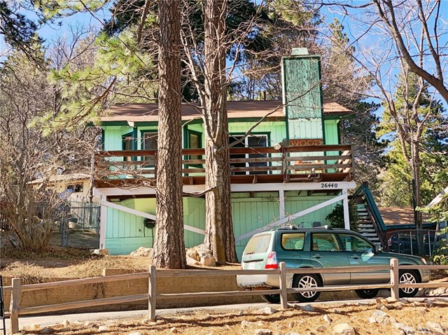 26440 Apache Trail Rimforest, CA 92378 - Photo 1 of 1 a car parked in front of a building