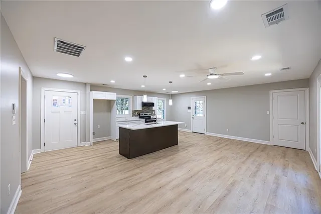 a view of kitchen with wooden floor