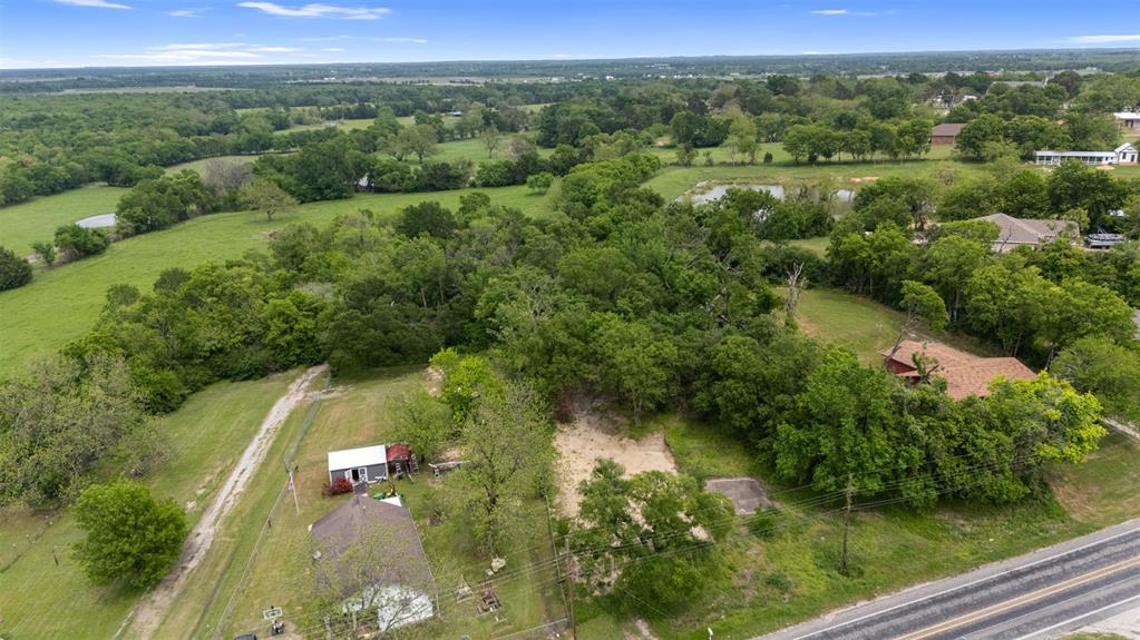 706 West Pyle Street Kaufman, TX 75142 - Photo 3 of 6 an aerial view of residential houses with outdoor space and trees