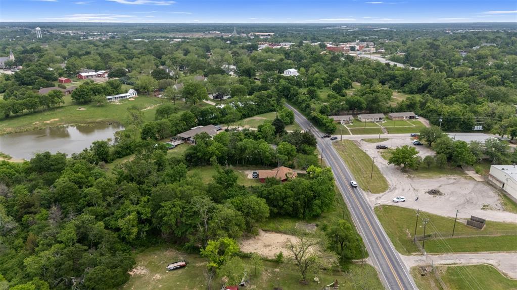 706 West Pyle Street Kaufman, TX 75142 - Photo 6 of 6 a view of a city from a balcony with a yard