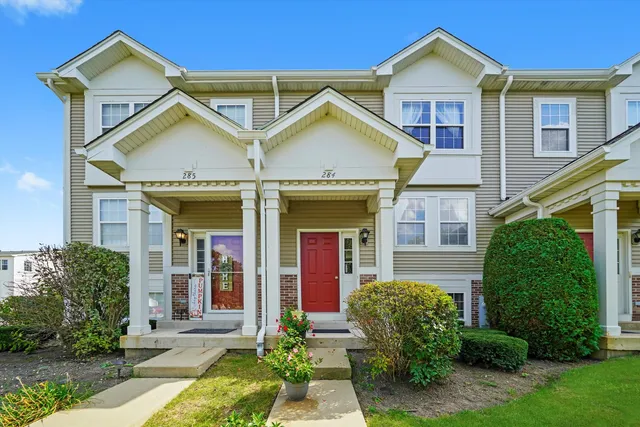 a view of a yard in front view of a house