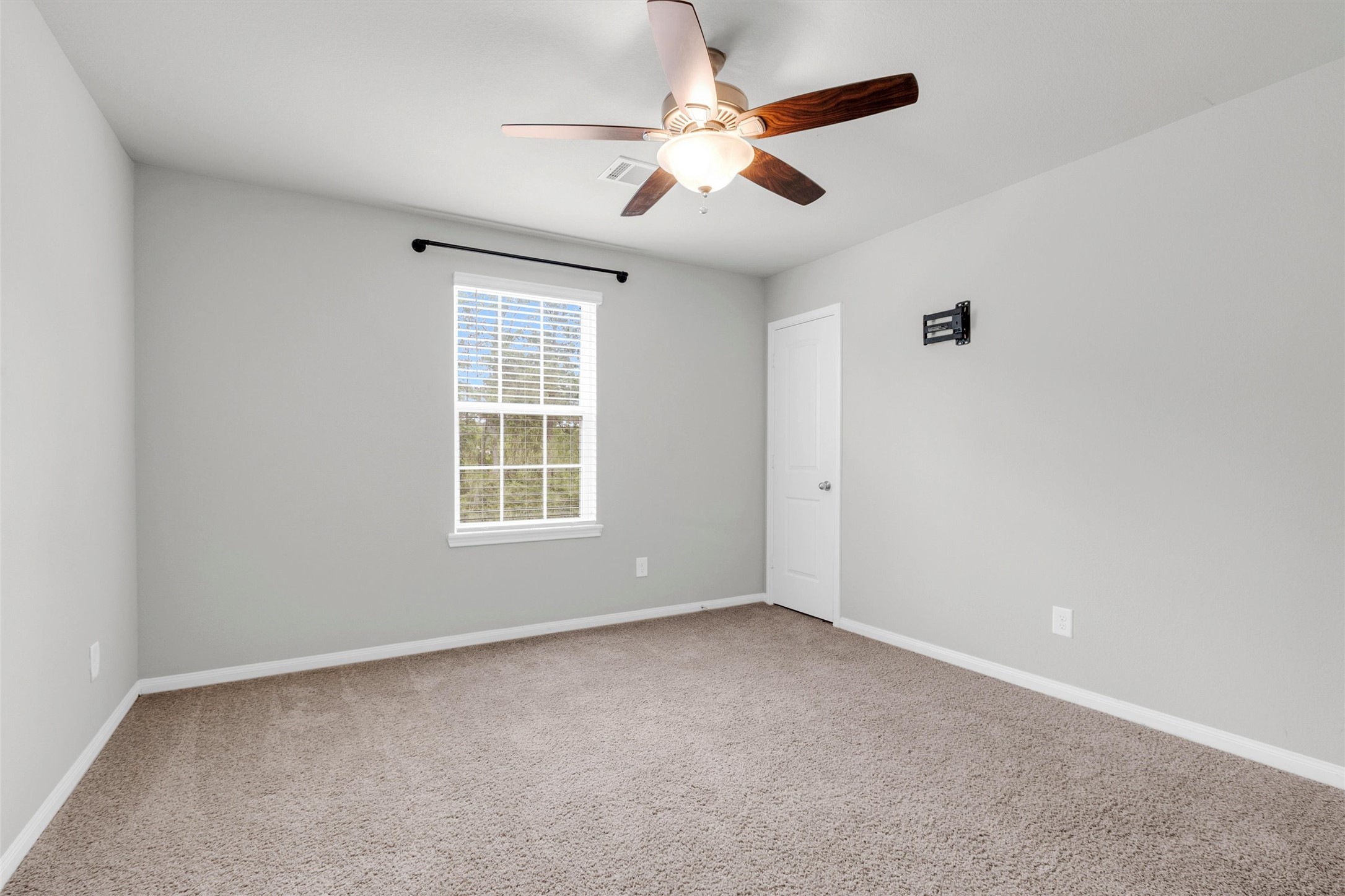 13534 Luke Prairie Willis, TX 77378 - Photo 21 of 29 This secondary bedroom faces the front of the home.