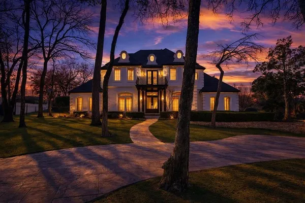 a front view of a house with a yard