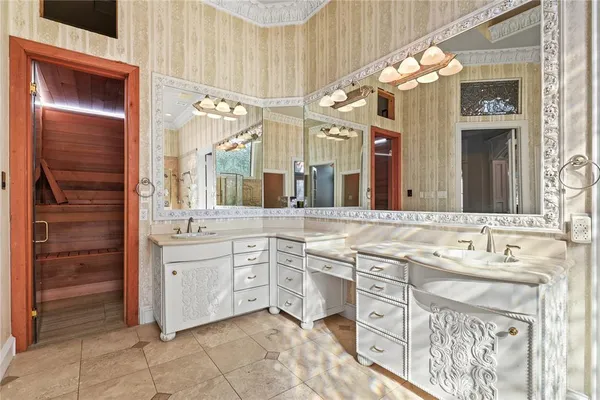 a spacious bathroom with a sink and a mirror
