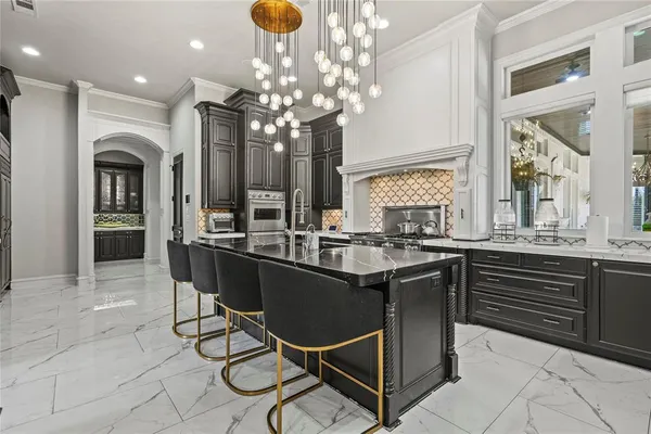 a kitchen with a dining table and chairs
