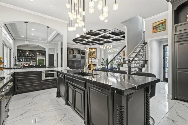 a kitchen with stainless steel appliances granite countertop a stove and a sink
