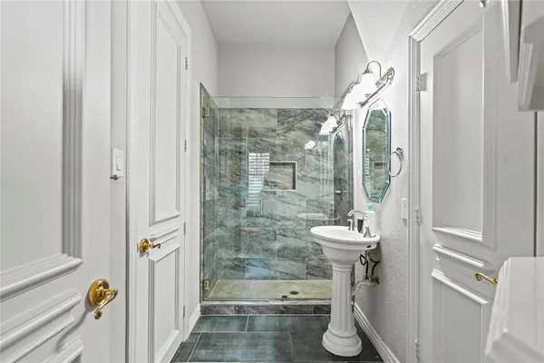 a bathroom with a sink and mirror