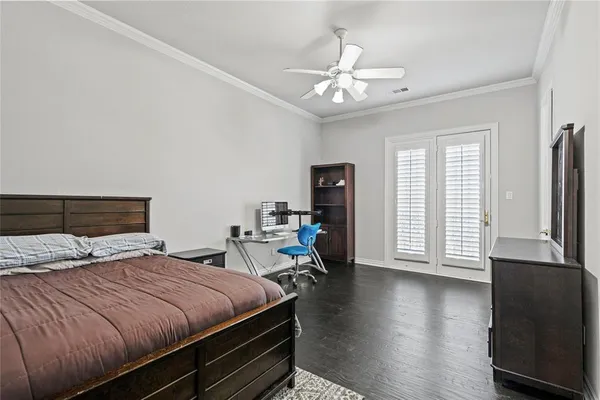 a bedroom with bed and window