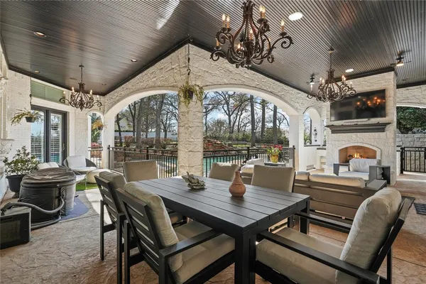 a view of a dining room with furniture wooden floor and chandelier
