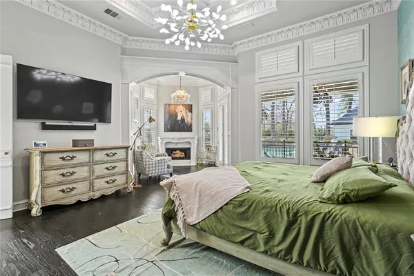 a bedroom with a bed and flat screen tv