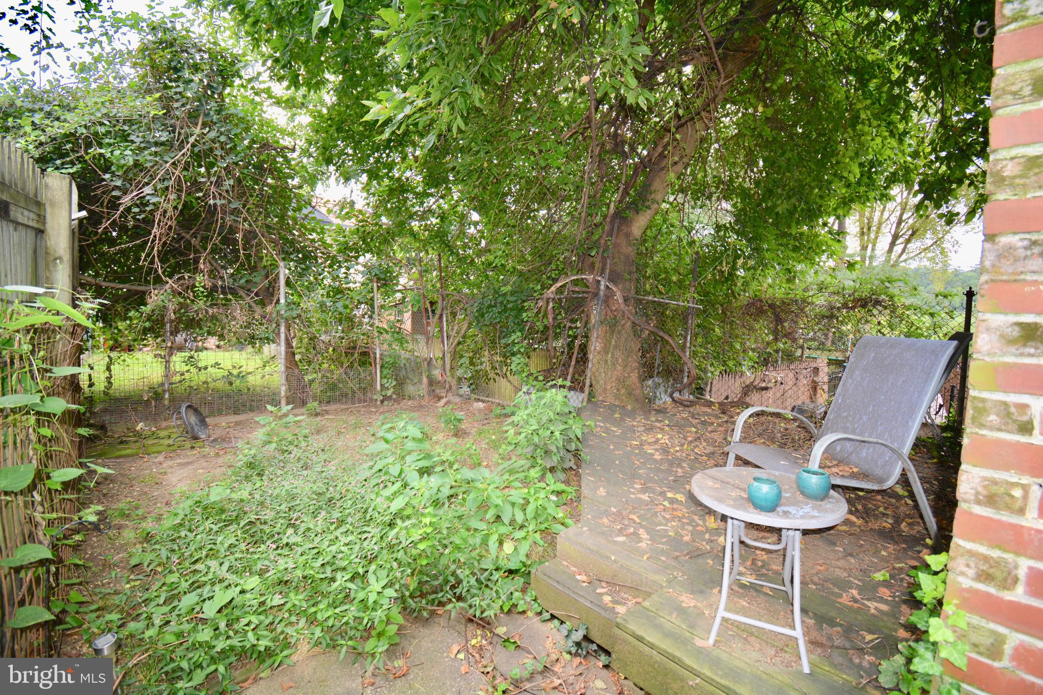 3694 Calumet Street, Unit 1 Philadelphia, PA 19129 - Photo 18 of 18 a view of a chairs and table in backyard