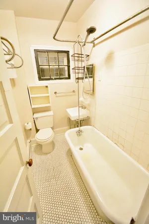 a bathroom with a bathtub and sink