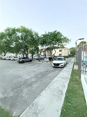 a view of a street with cars