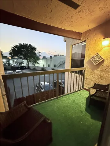 a view of a porch with furniture