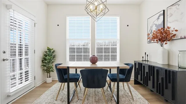 a view of a dining room with furniture and window