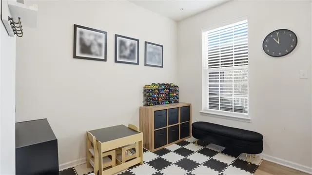 a bedroom with furniture and a window