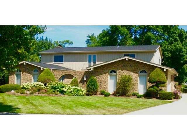 2109 Valley Road Northbrook, IL 60062 - Photo 1 of 13 a front view of a house with a garden