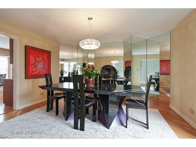 2109 Valley Road Northbrook, IL 60062 - Photo 4 of 13 a view of a dining room and hall with wooden floor