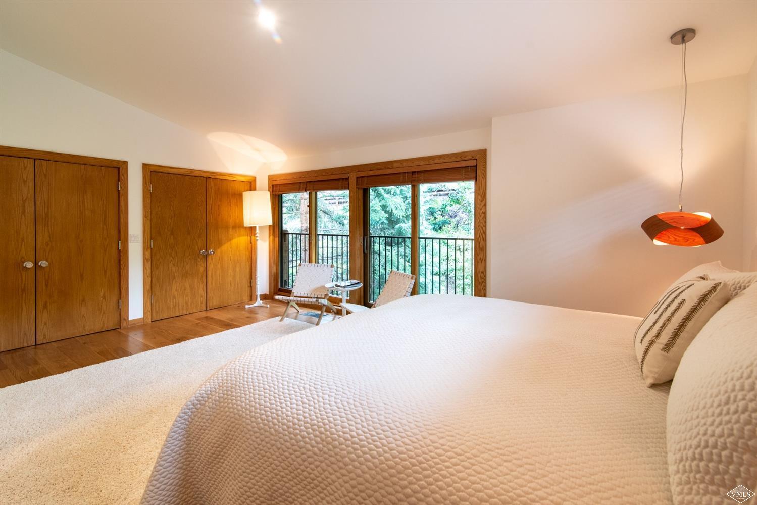 950 Red Sandstone Road, Unit 40 Vail, CO 81657 - Photo 12 of 23 a bedroom with a bed and a large window