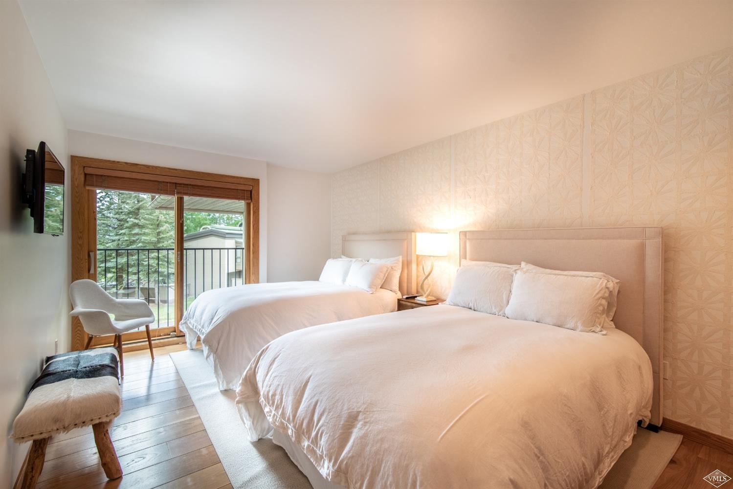 950 Red Sandstone Road, Unit 40 Vail, CO 81657 - Photo 17 of 23 a bedroom with a bed and a large window
