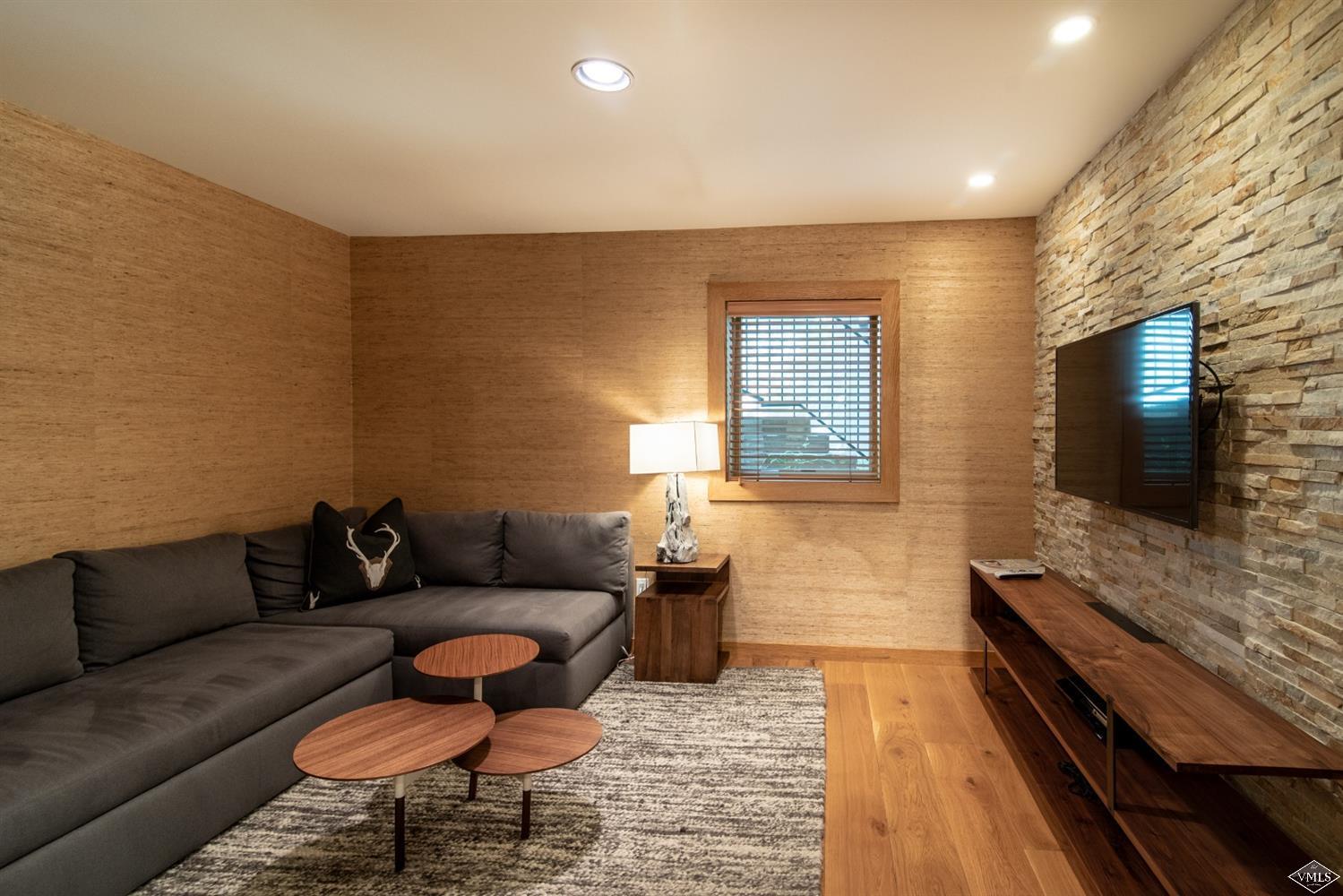950 Red Sandstone Road, Unit 40 Vail, CO 81657 - Photo 20 of 23 a living room with furniture and a flat screen tv