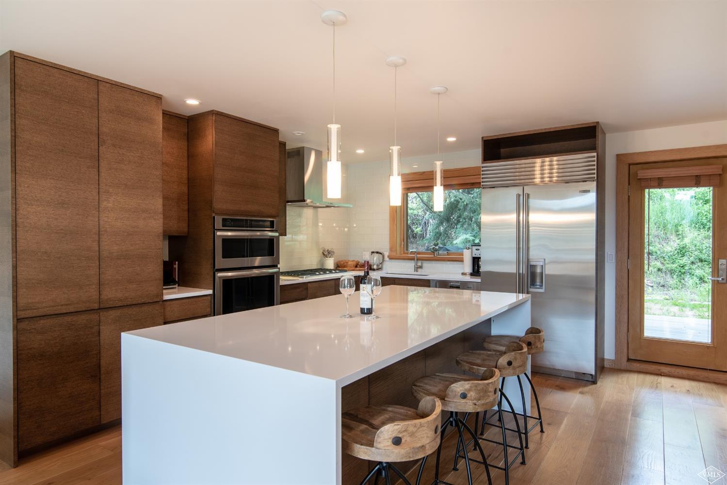 950 Red Sandstone Road, Unit 40 Vail, CO 81657 - Photo 8 of 23 a kitchen with stainless steel appliances a sink and a refrigerator