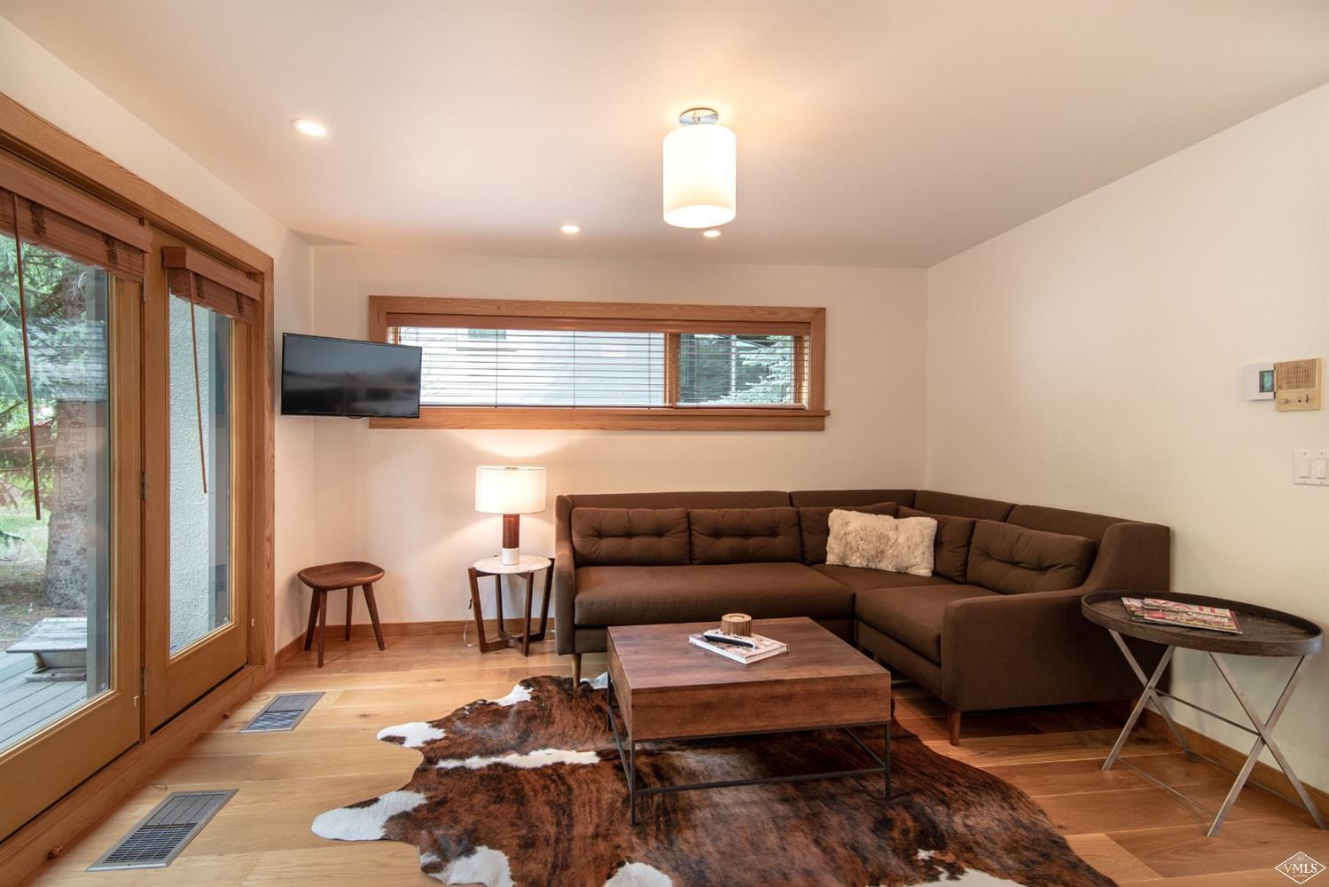 950 Red Sandstone Road, Unit 40 Vail, CO 81657 - Photo 10 of 23 a living room with furniture and a window