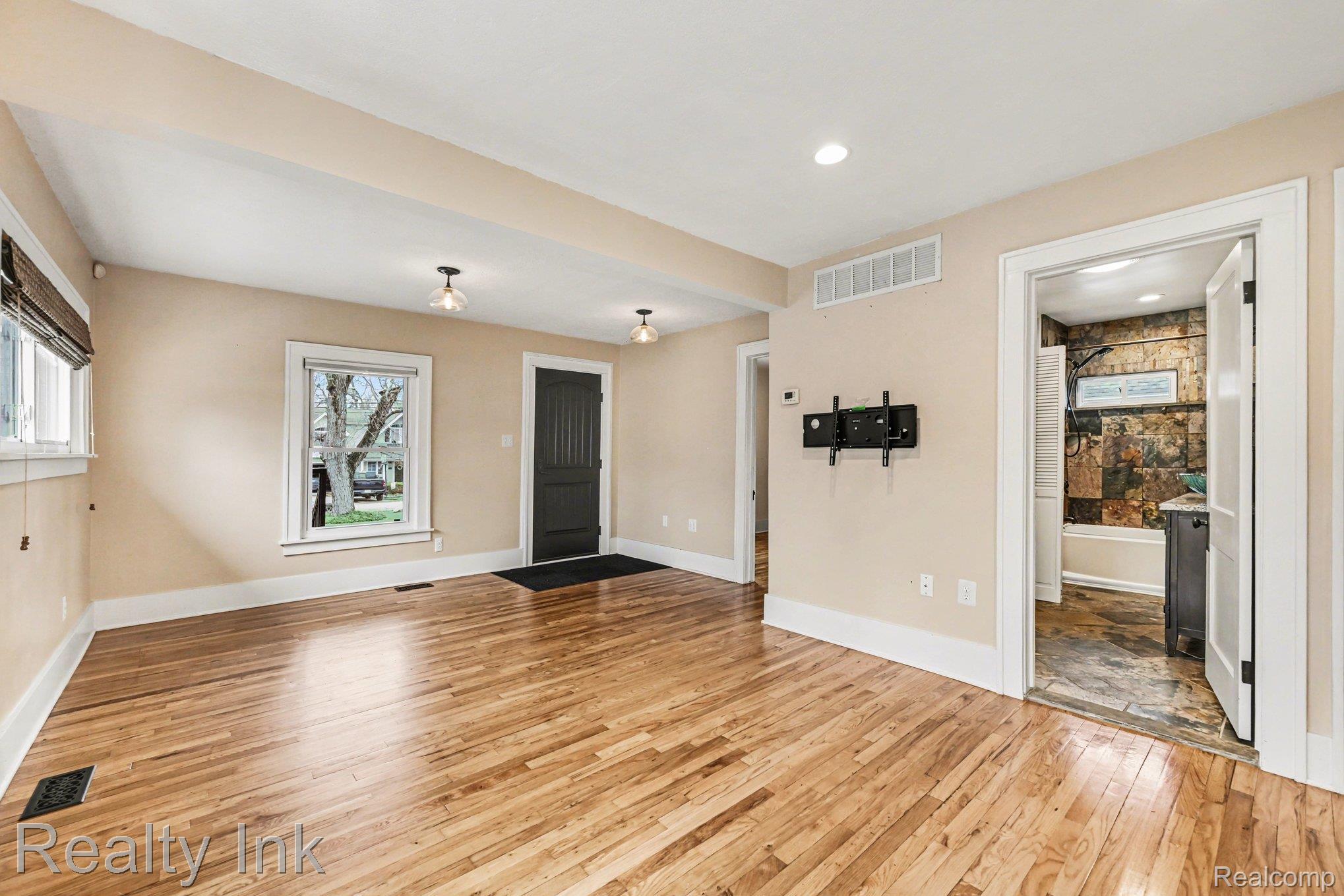 16944 Franklin Road Northville, MI 48168 - Photo 5 of 11 Unfurnished living room with light wood-style flooring and recessed lighting