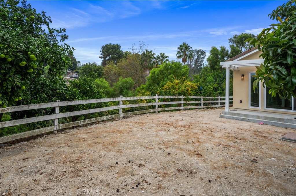 60 Ranchview Road, Unit 1/2 Rolling Hills Estates, CA 90274 - Photo 16 of 21 a view of a yard with wooden fence