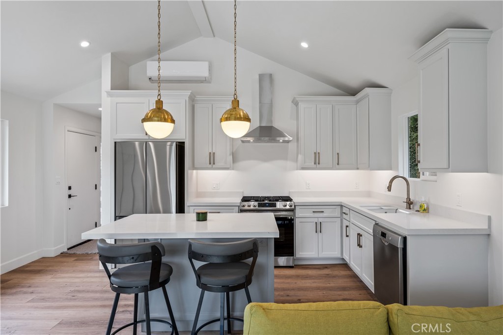 60 Ranchview Road, Unit 1/2 Rolling Hills Estates, CA 90274 - Photo 2 of 21 a kitchen with a sink cabinets and wooden floor