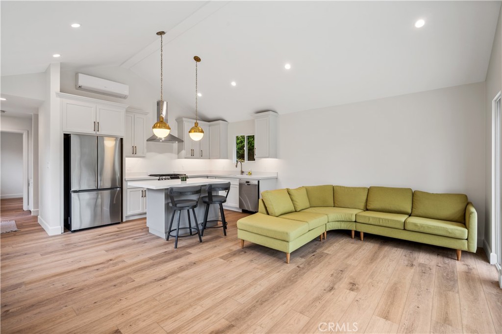 60 Ranchview Road, Unit 1/2 Rolling Hills Estates, CA 90274 - Photo 4 of 21 a living room with furniture kitchen view and a wooden floor
