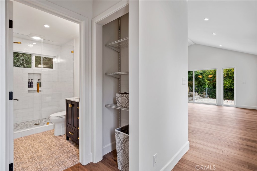 60 Ranchview Road, Unit 1/2 Rolling Hills Estates, CA 90274 - Photo 10 of 21 a view of a hallway with bathroom and wooden floor