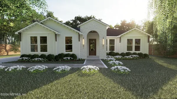 a front view of a house with a yard and porch