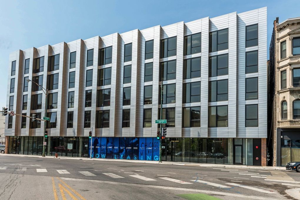 a view of a building with a street