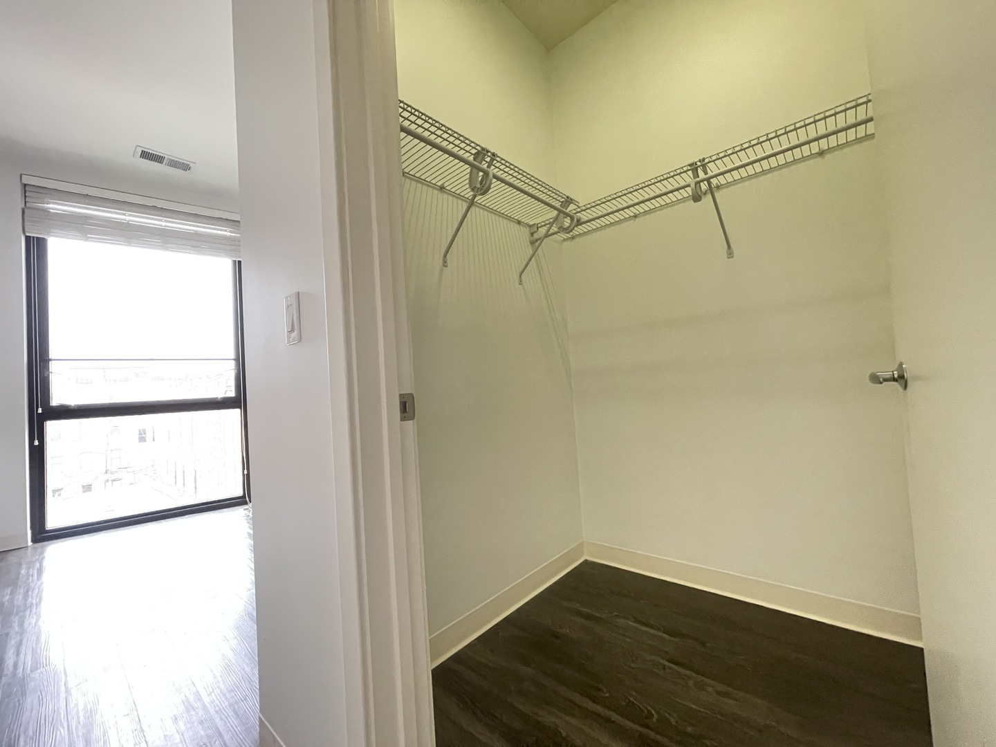 Undisclosed Address Chicago, IL 60642 - Photo 11 of 25 a view of a room with wooden floor and cabinet