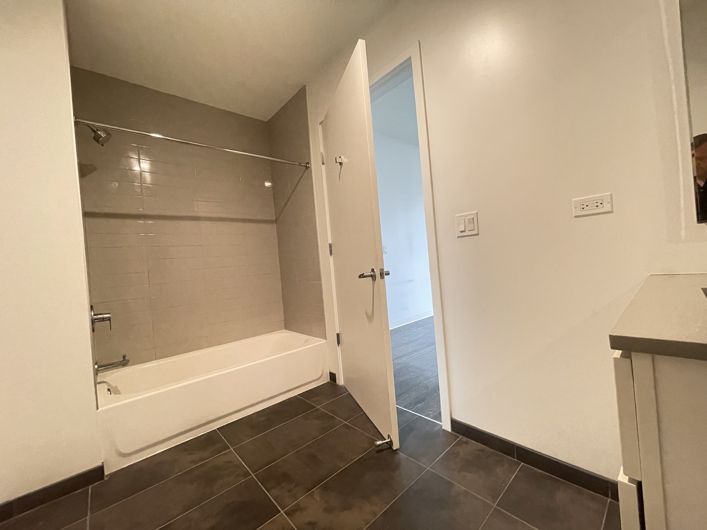 Undisclosed Address Chicago, IL 60642 - Photo 13 of 25 a bathroom with a bathtub and a shower