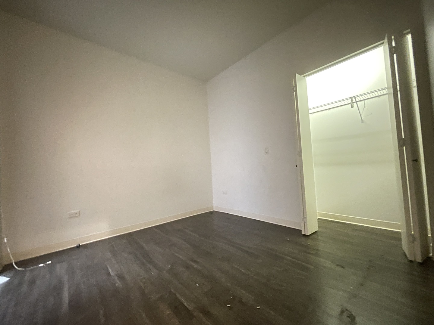 Undisclosed Address Chicago, IL 60642 - Photo 21 of 25 an empty room with wooden floor and door